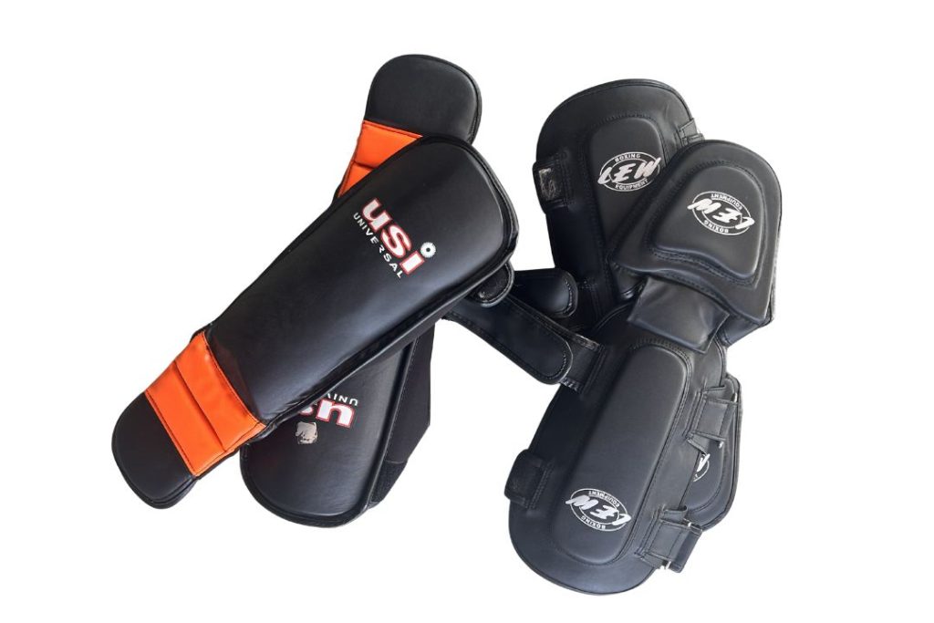 Padded shin guards for Muay Thai kick training and sparring